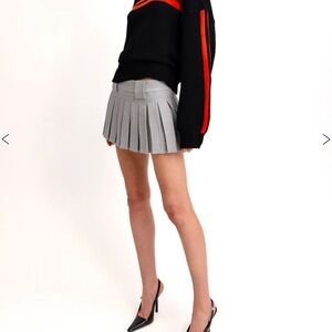 With Jean Hudson pleated skirt